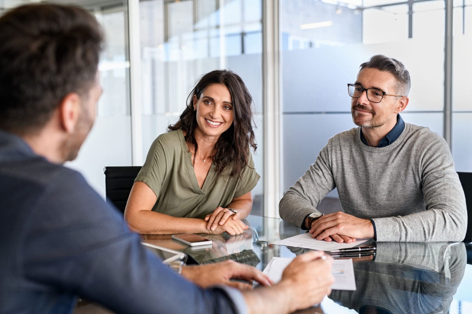 Three people having a business meeting.